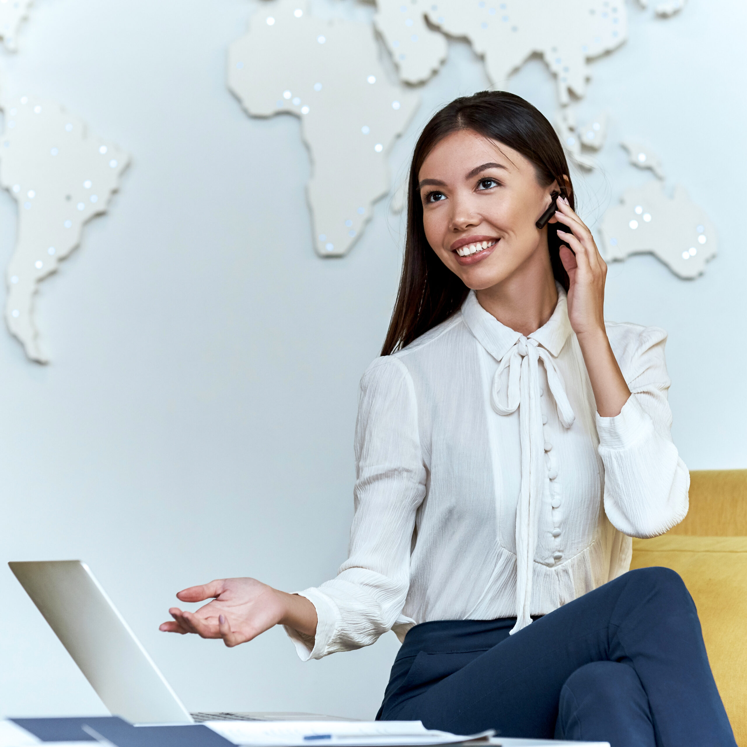 Young travel agent in a tour agency are showing presentation by phone of a travelling concept tour destination